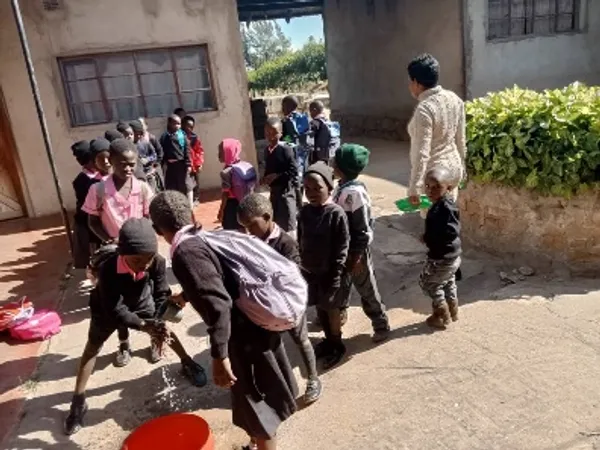 A child reading a book in a classroom